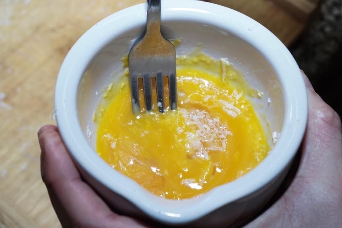 Adding the egg yolks