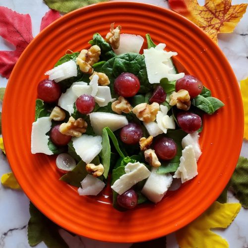 French salad with walnuts, grapes, and pears